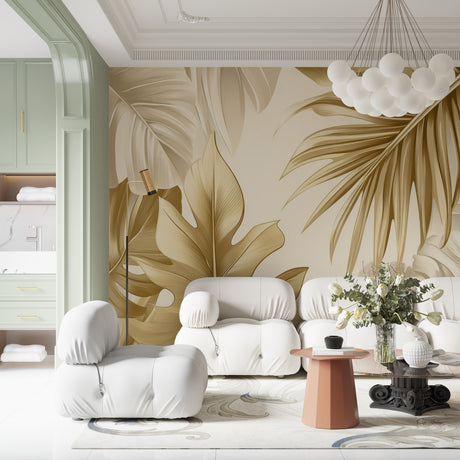 Tropical palm leaf wallpaper in gold tones creating a stunning accent wall in a modern living room
