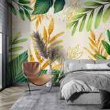 Leafy green wallpaper with gold details in a bright home office setting