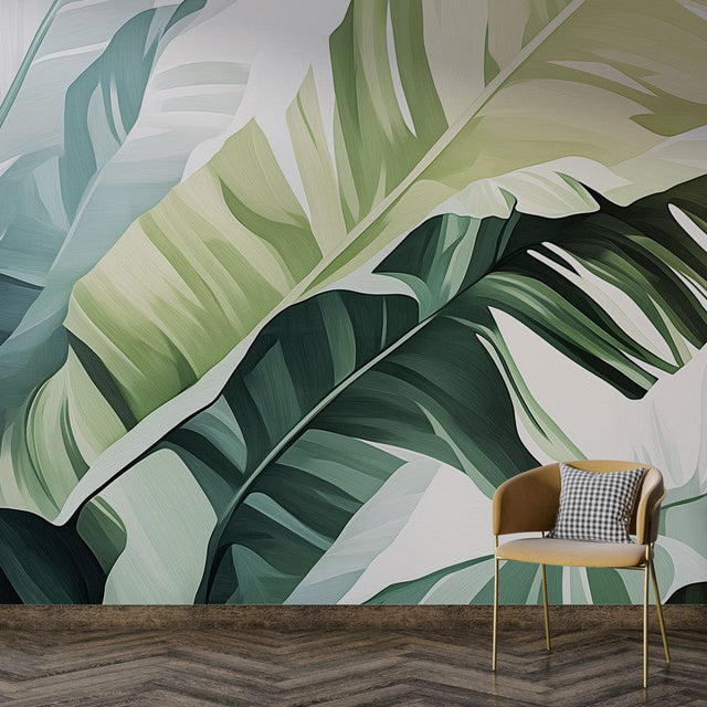 Tropical banana leaf wallpaper mural creating a fresh statement wall in a modern living room with white furniture