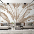 Tropical leaf wallpaper with beige banana leaves creating a calm atmosphere in a modern living room with natural light