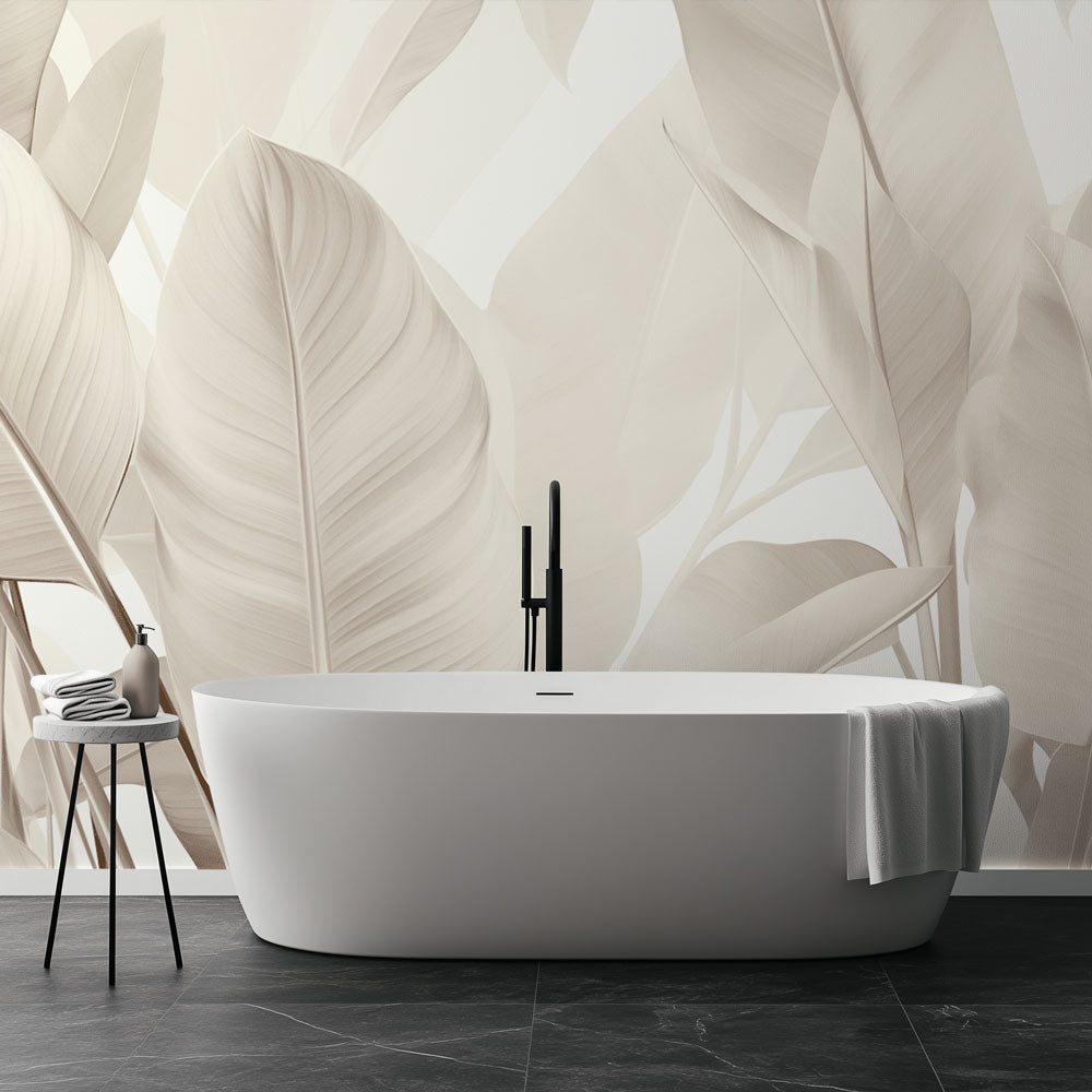 Tropical leaf wallpaper creating a serene atmosphere in a modern living room with beige and cream tones