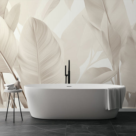 Tropical leaf wallpaper creating a serene atmosphere in a modern living room with beige and cream tones