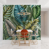 Monstera leaf wallpaper in home office with minimal desk setup
