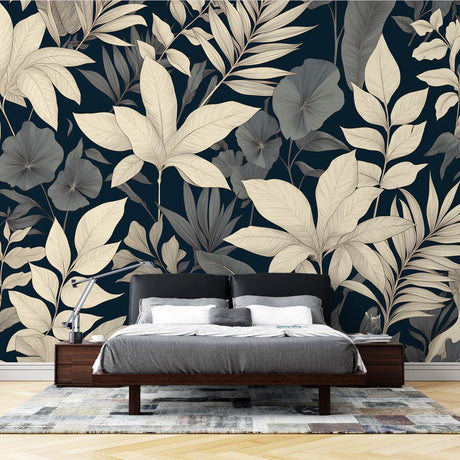 Tropical botanical wallpaper with cream leaves on black background styled in modern living room with minimal furniture