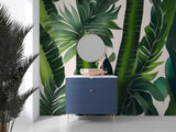 Green palm leaves mural wallpaper in a master bedroom adding natural charm