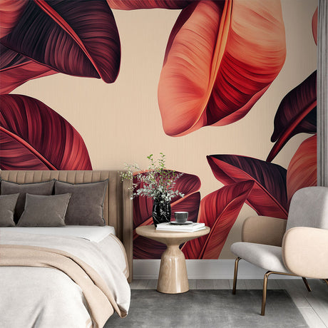 Tropical leaf wallpaper with burgundy leaves creating a dramatic accent wall in a modern living room