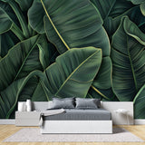 Banana leaf wall mural adding depth to a minimalist dining room setting