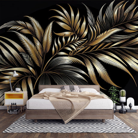 Black and gold palm leaf wallpaper creating dramatic impact in a modern living room with high ceilings and minimalist furniture