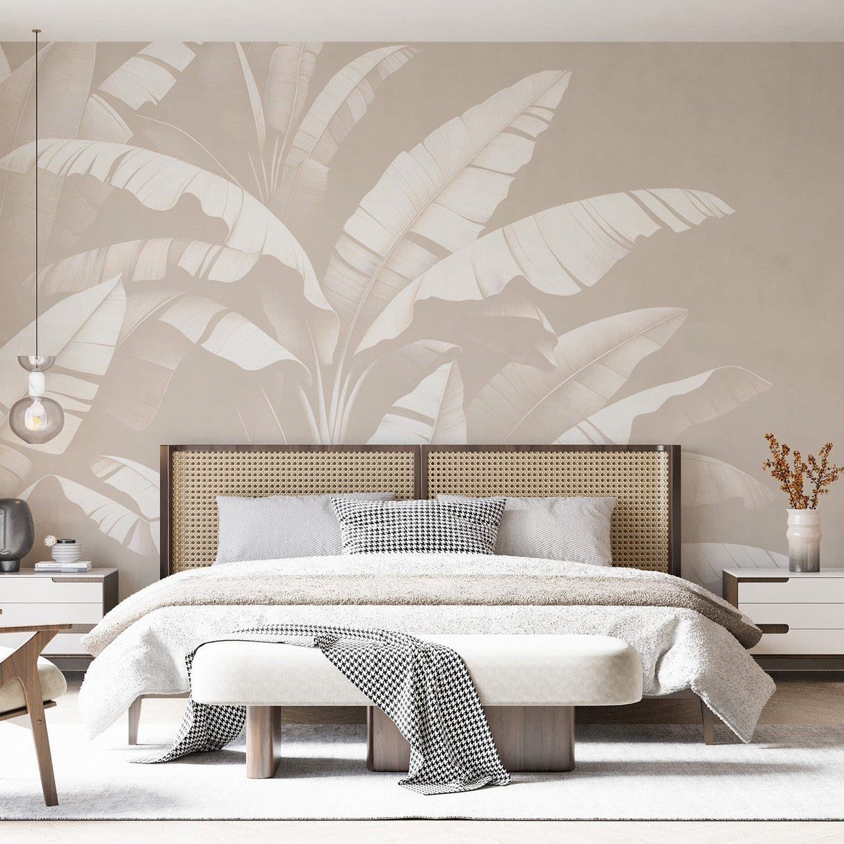 Tropical leaf wallpaper in modern minimalist living room showing large-scale banana leaves in white against soft beige