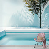 Minimalist tropical palm shadow wallpaper creating a serene atmosphere in a modern living room with clean lines and natural light