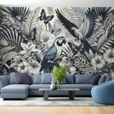 Tropical bird wallpaper with monochrome parrots in a modern living room setting showing scale and dramatic impact