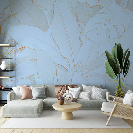 Tropical leaf wallpaper with gold monstera design creating a luxurious atmosphere in a modern living room