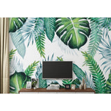 Monstera wall mural creating calm atmosphere in minimalist bedroom setting