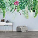 Tropical leaf wallpaper with monstera and hummingbird creating a serene atmosphere in a modern living room
