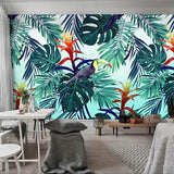 Monstera leaf wallpaper with toucan transforming a home office into a jungle paradise