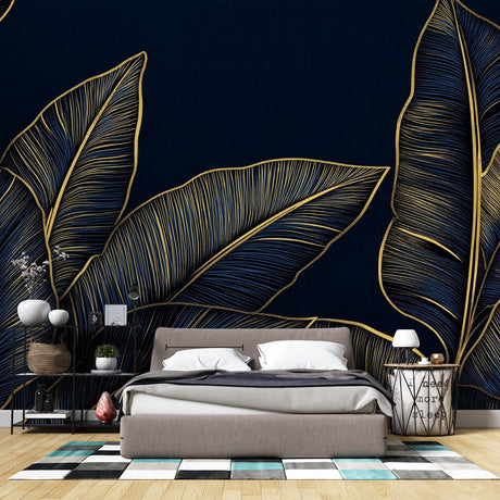 Tropical leaf wallpaper in navy and gold creating a stunning accent wall in a modern living room with high ceilings