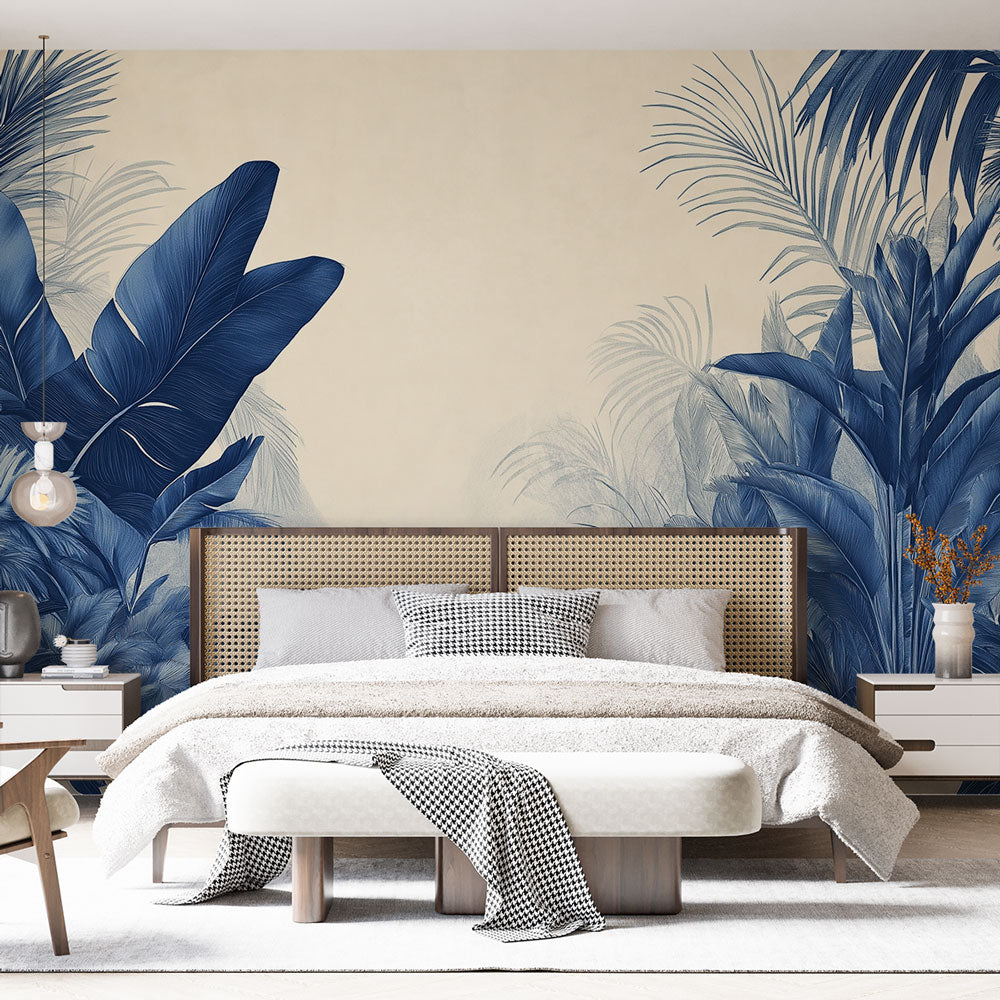 Tropical palm leaf wallpaper in navy blue creating a stunning accent wall in a modern living room with natural light