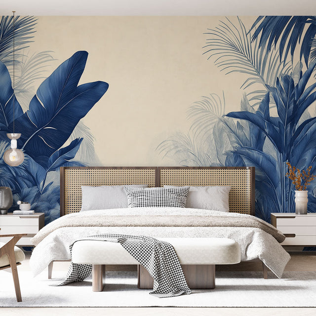 Tropical palm leaf wallpaper in navy blue creating a stunning accent wall in a modern living room with natural light