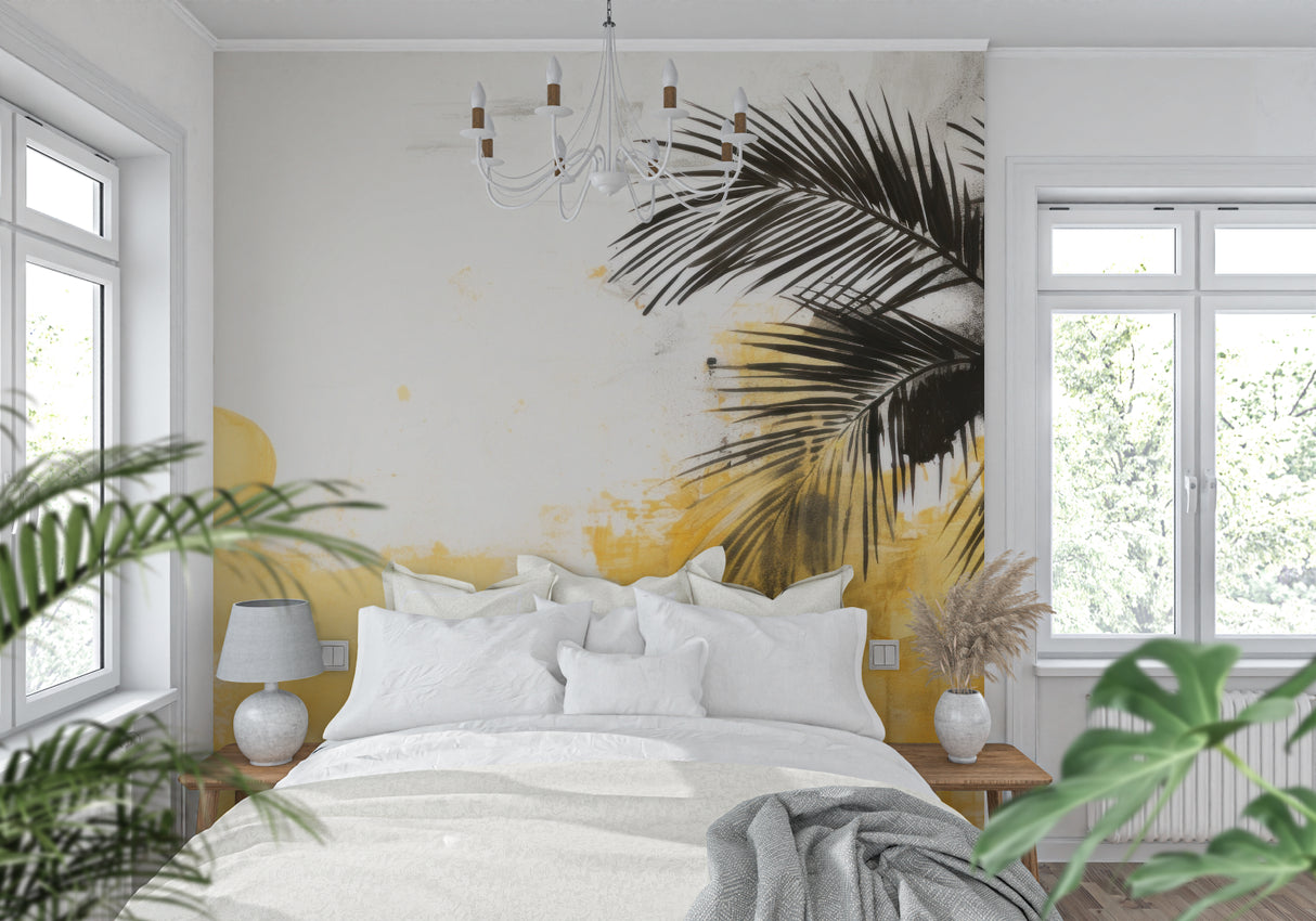 Palm leaves wall mural with yellow sunset backdrop in a cozy bedroom setting