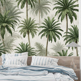 Tropical palm wallpaper making a statement in a bright home office with wooden desk