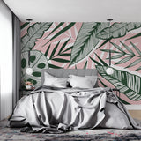 Palm leaf wall mural adding style to a home office with soft pink background