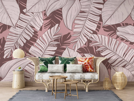 Tropical leaf wallpaper in modern living room showing pink banana leaf pattern creating depth and warmth