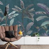 Silver banana leaf mural in master bedroom with white bedding and teal accents
