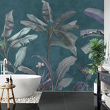 Tropical leaf wallpaper in home office with modern furniture and brass details