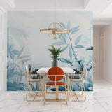 Tropical palm leaf wallpaper in modern living room showing soft blue botanical pattern creating peaceful atmosphere