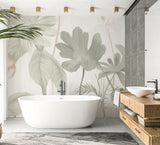 Monstera leaf mural in bright living room with natural wood furniture and green plants