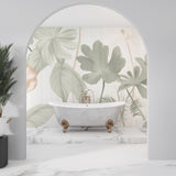 Tropical foliage wallpaper in home office with desk and natural lighting