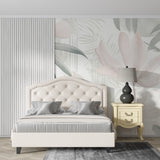 Pink and sage tropical wallpaper creating calm atmosphere in master bedroom