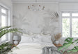 Tropical palm leaf wallpaper in modern living room showing soft beige and grey tones