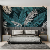 Home office space with botanical wall mural showing large-scale palm leaves