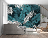 Hotel lobby showcasing dramatic palm leaf wallpaper in teal and white tones