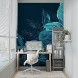 Tropical leaf wallpaper in modern living room showing teal jungle leaves against navy background