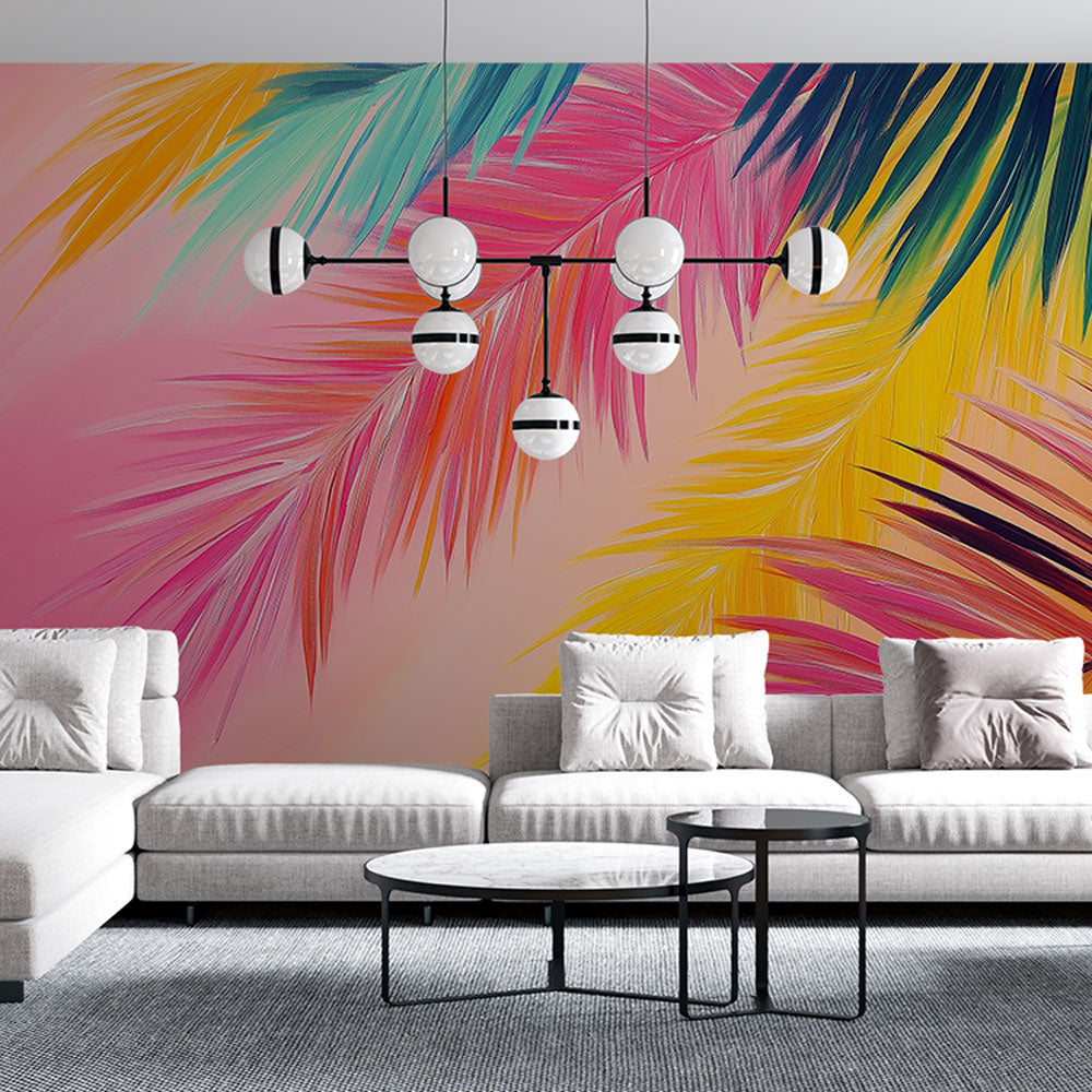 Tropical palm leaf wallpaper in pink and gold tones brightening a modern living room with natural light