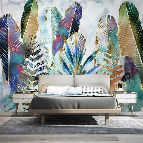 Tropical leaf wallpaper with watercolor feathers and ferns creating a calm atmosphere in a modern living room
