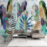 Feather and fern wallpaper adding natural elegance to a dining room with soft watercolor effects