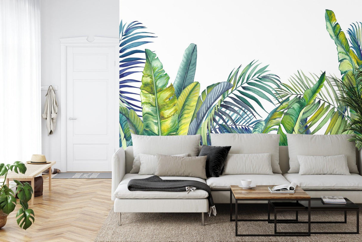 Tropical leaf wallpaper creating a fresh mood in modern living room with white furniture