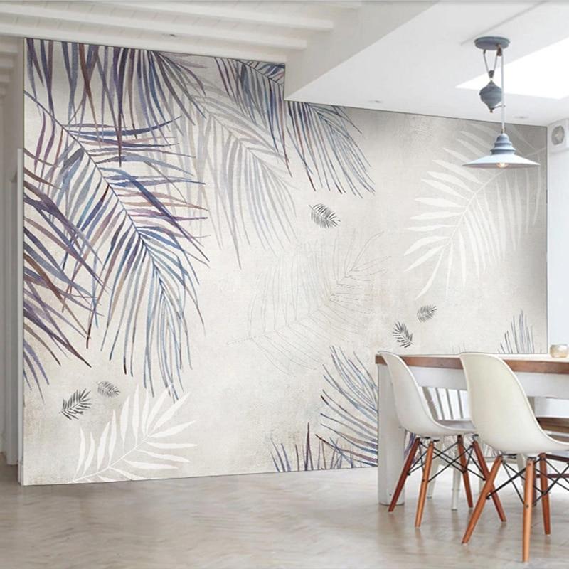 Palm leaf mural wallpaper creating calm atmosphere in master bedroom with natural light