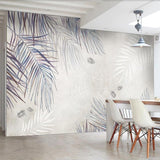 Palm leaf mural wallpaper creating calm atmosphere in master bedroom with natural light
