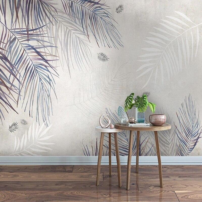 Watercolor palm leaves wallpaper in coastal style dining room with white furniture