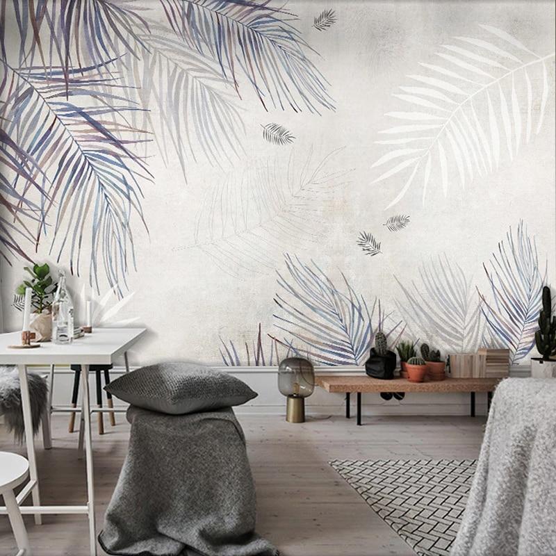 Palm frond wallpaper showcased in bright bathroom with modern fixtures