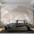 Tropical banana leaf wallpaper in modern living room, white leaves on beige creating a bright, airy atmosphere