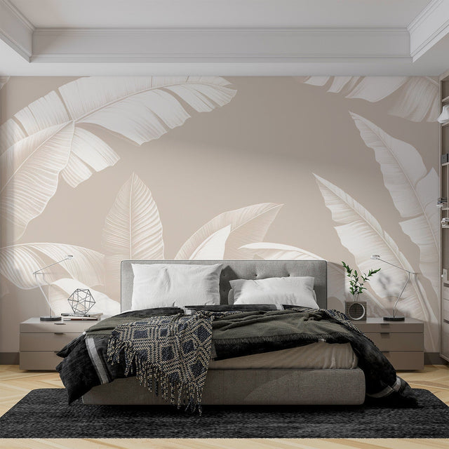 Tropical banana leaf wallpaper in modern living room, white leaves on beige creating a bright, airy atmosphere