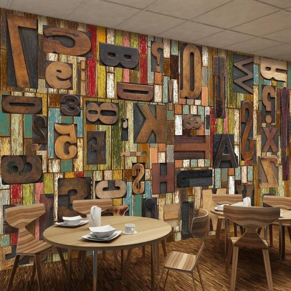 Industrial typography mural wallpaper making a statement in a trendy coffee shop interior