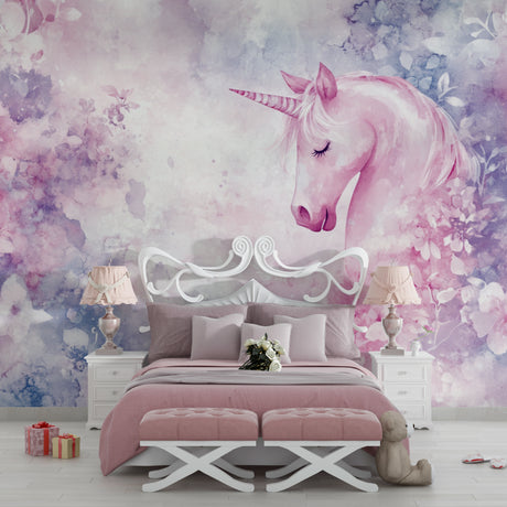 Pink unicorn wallpaper mural in a bright nursery with white furniture