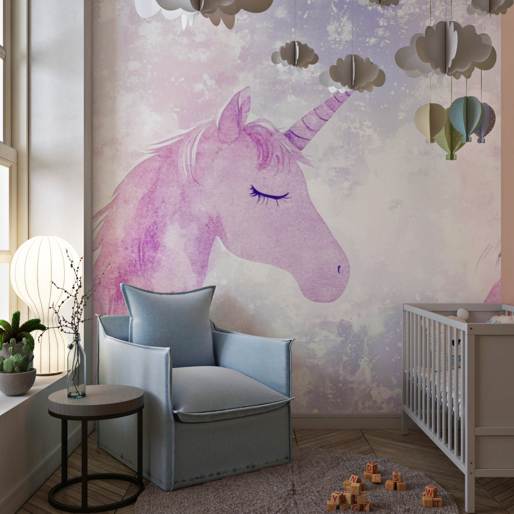 Pink unicorn wallpaper creating a magical atmosphere in a girl's bedroom with soft lighting