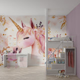 Pink and gold unicorn wallpaper brightening a child's playroom with natural light